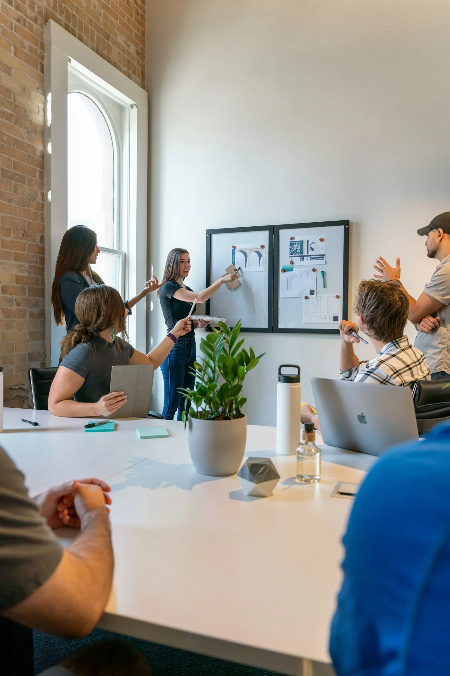 A team discussing ideas around a studio table