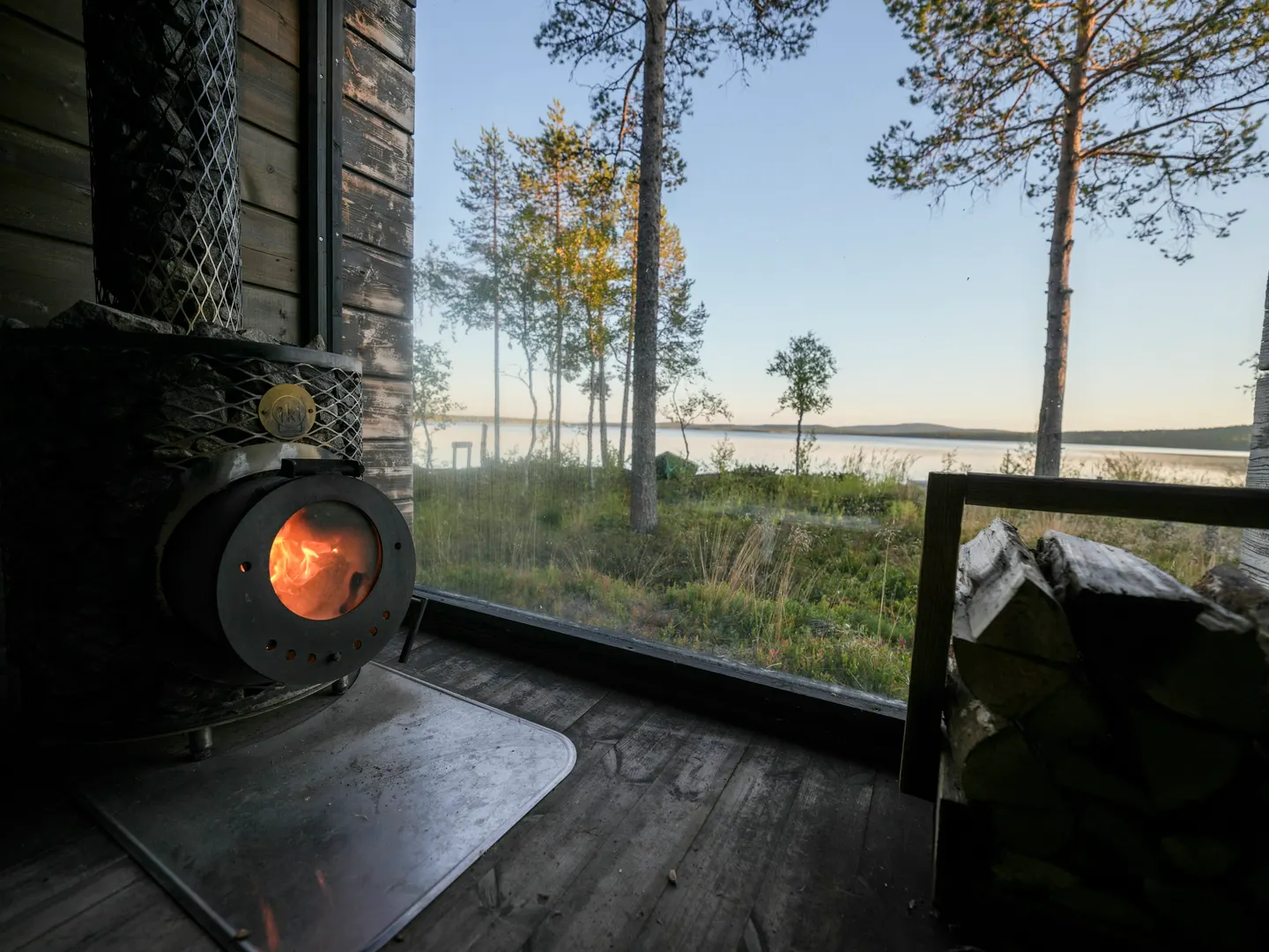 Wood-stove sauna with a window onto the lake