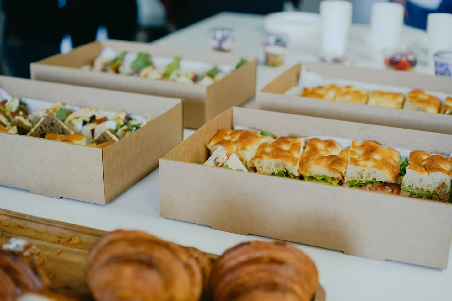Boxed sandwich lunches set out on a table