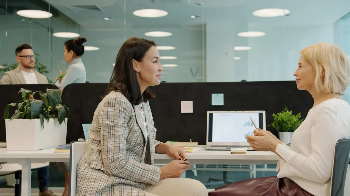 Workplace conversation across a shared table