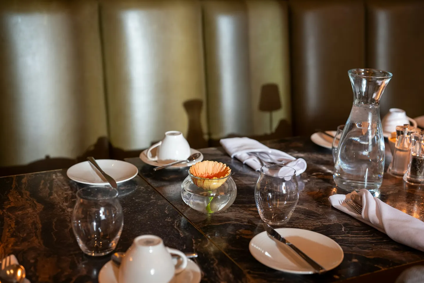 Table set with dessert, coffee and glasses