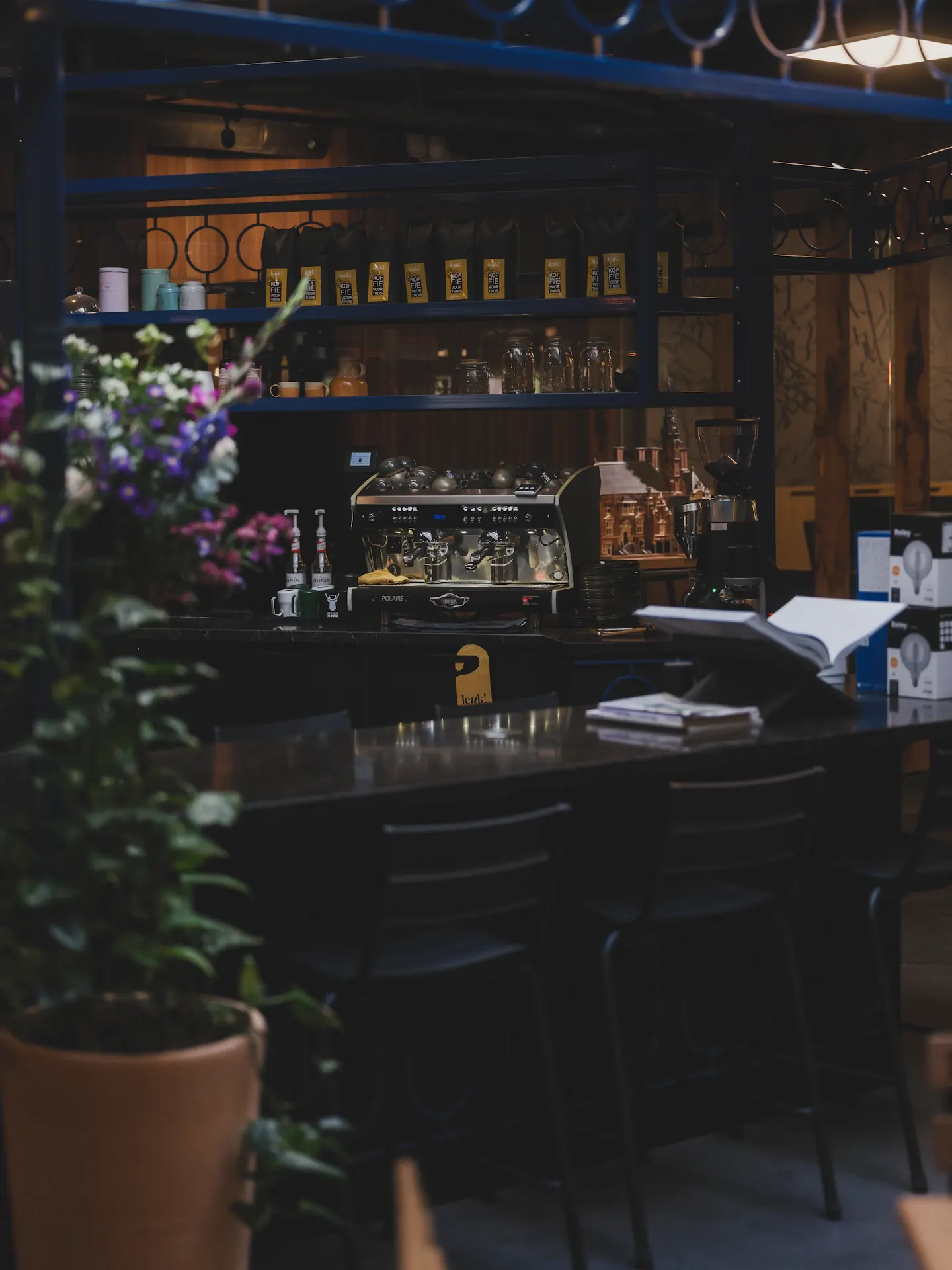 Intimate café counter with flowers and warm lighting