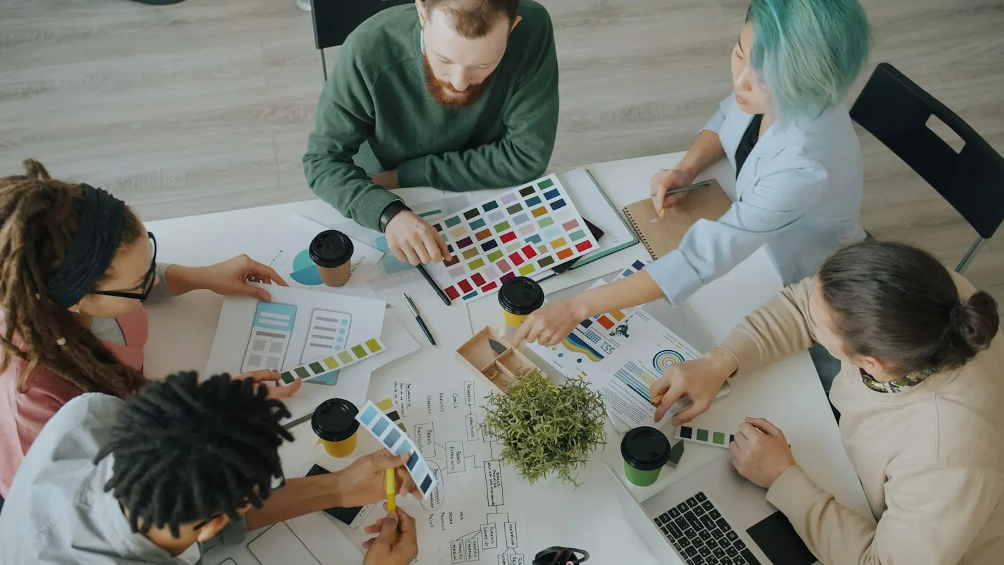 People collaborating at a design workspace
