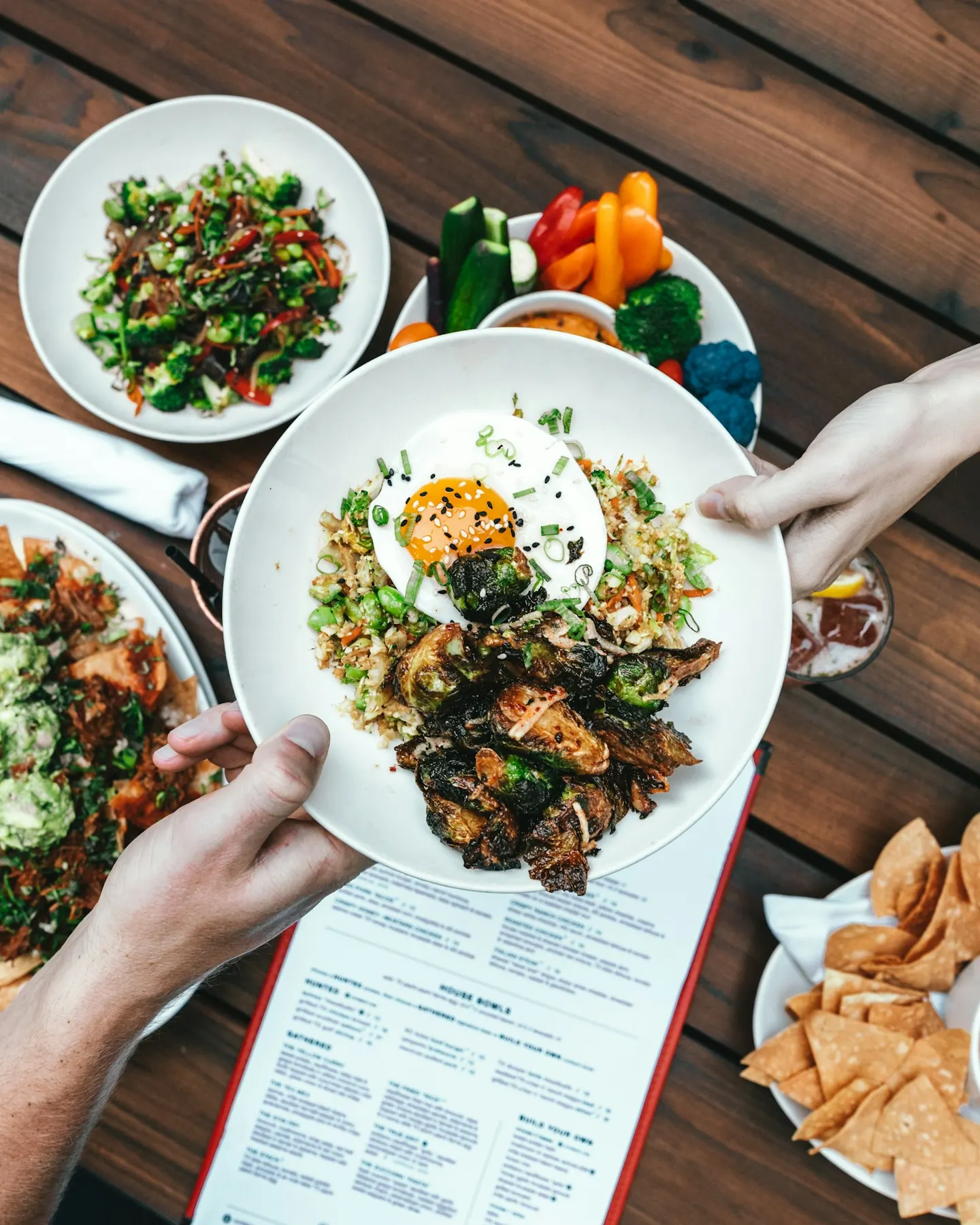 Fresh dishes served across a restaurant table