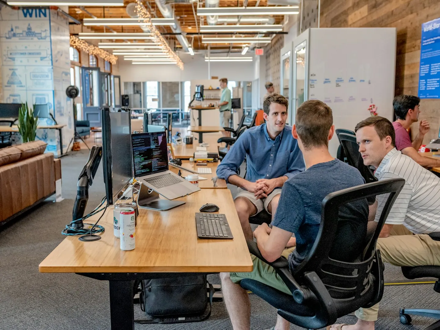 People meeting around tables in an office