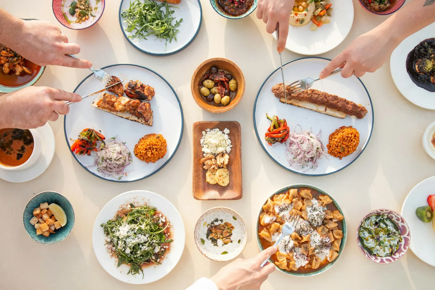 Shared plates of seasonal dishes across a table